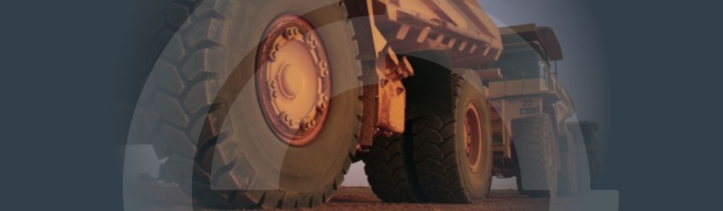 Downtime Meets its Match in Work Instructions Banner Banner for the 'Downtime Meets its Match in Work Instructions' article with a background image of a haul truck