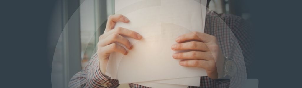 Mobile equipment legislation update-banner Banner for the 'Site Validation the difference between generic and specific documents' article with a background image of an employee organising papers