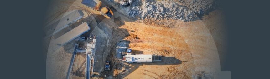Banner for the 'End-to-End Experience Drives Solutions Banner' article with a background image with different large mining mobile equipment