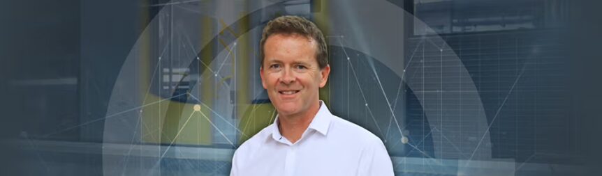 A picture of Adam Sharp of a background of Sydney train and data