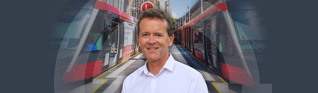 A picture of Adam Sharp of a background with some of Sydney's trains