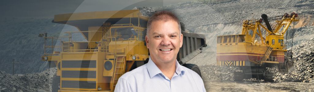 Predicting the Unpredictable_ CLefoe A picture of Craig Lefoe on a mining haul trucks background