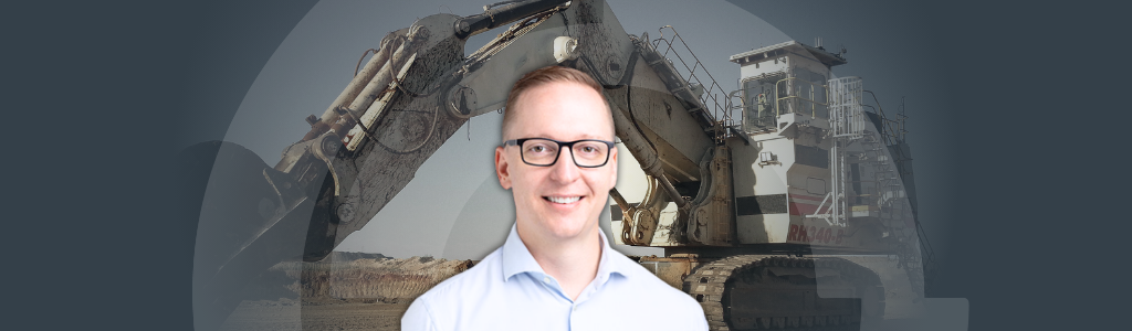 Banner-Effective AM for Mining Org-v2 A picture of Josh Old with an excavator in the background