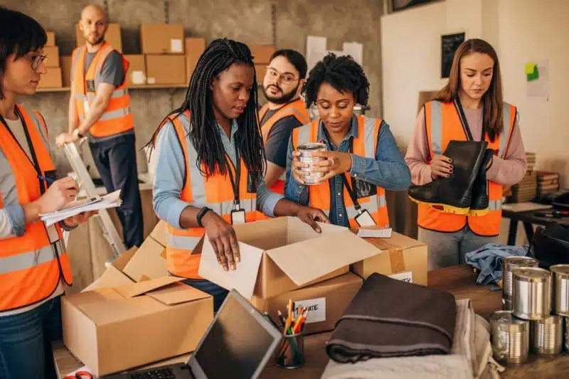 group of people doing community service filling care packages